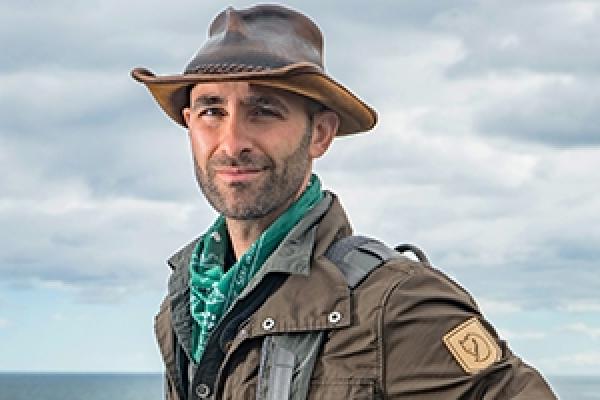Color image of Coyote Peterson wearing a wide brimmed hat