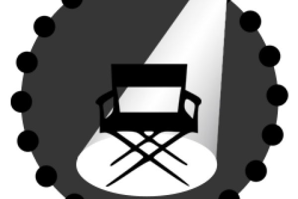A black and white image of a cartoon director's chair sitting empty in a spotlight